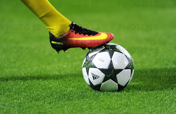 Nike football shoe on Adidas Champions League Ball