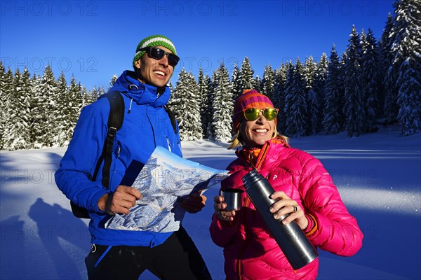 Two hikers on a premium winter hiking trail