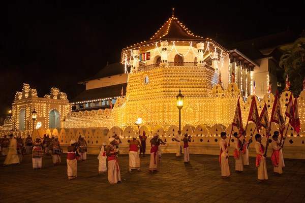 Flag bearers and drummers in traditional costumes