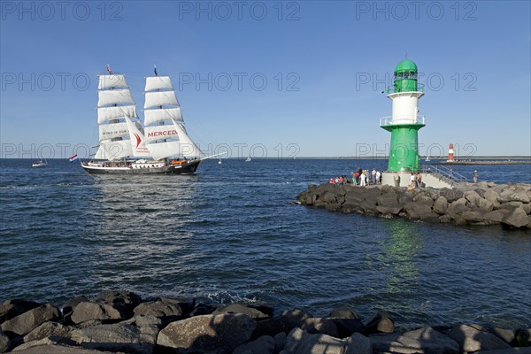 Lighthouse with sailing boat Mercedes at back