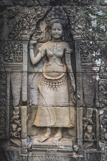 Stone relief of a divine dancer