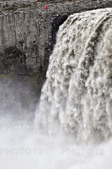 Person at the waterfall Dettifoss