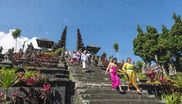 Devout Balinese descend stairs