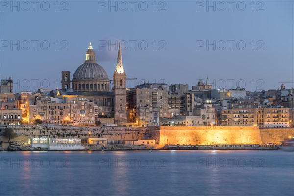 City view with St. Paul's Pro Cathedral and Carmelite Church at dusk