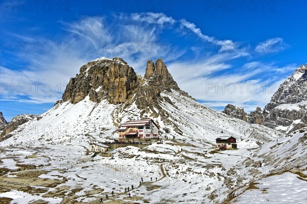 Dreizinnenhutte in front of Sextener Stein and Toblinger Knoten in the snow