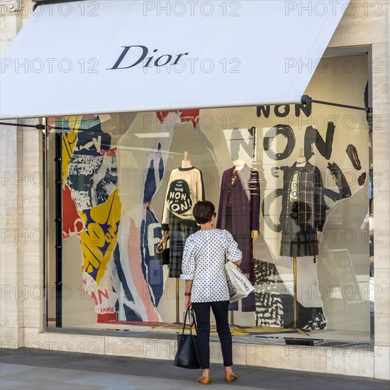Passer-by in front of shop window