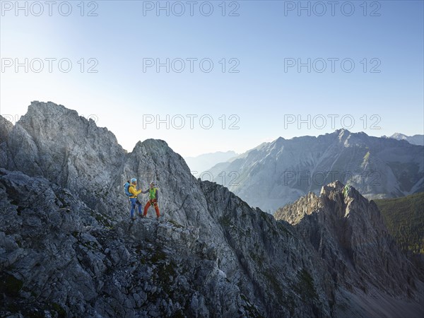 Two climbers on a via ferrata
