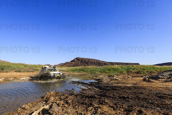 SUV crossing water