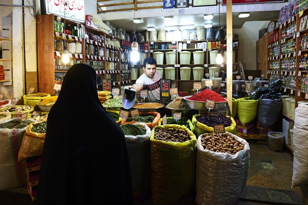 Spice dealer in the bazaar under the arcades of Imam Square