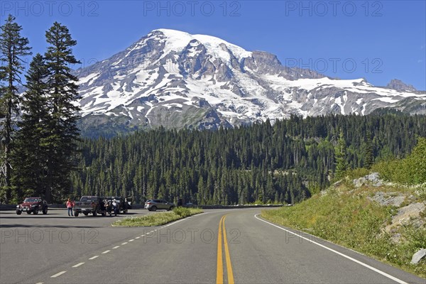 Snow-capped summit of Mount Rainier and road
