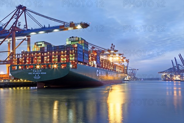 Container ship at night in the port of Hamburg