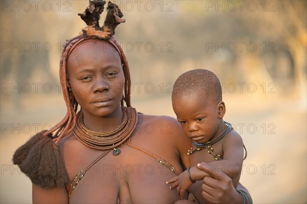 Portrait of a young woman with child