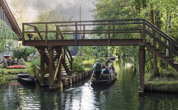 Tourists in a Spreewald boat under bridge. Lubbenau