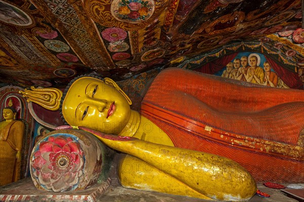 Reclining Buddha statue and painted ceilings