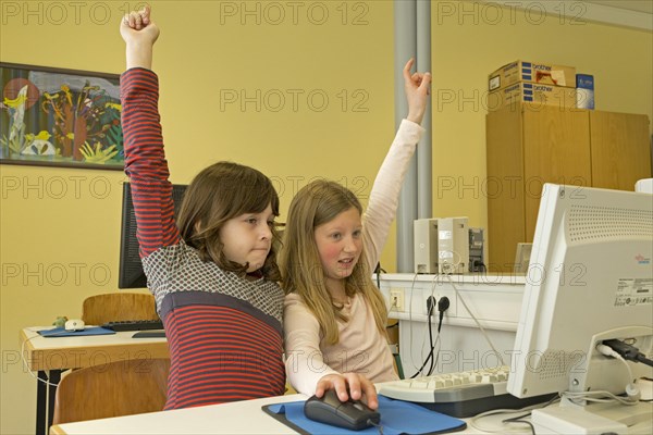 Elementary school girls working in computer room