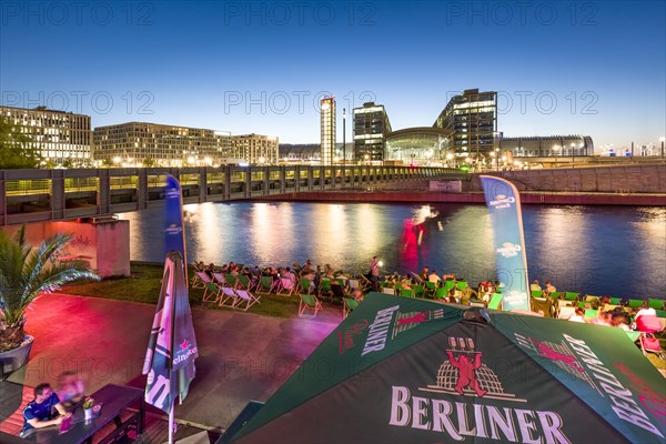 Beach bar Capital Beach at dusk at the river Spree opposite central railway station