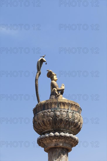 Statue of king Yoganarendra Malla with snake and bird
