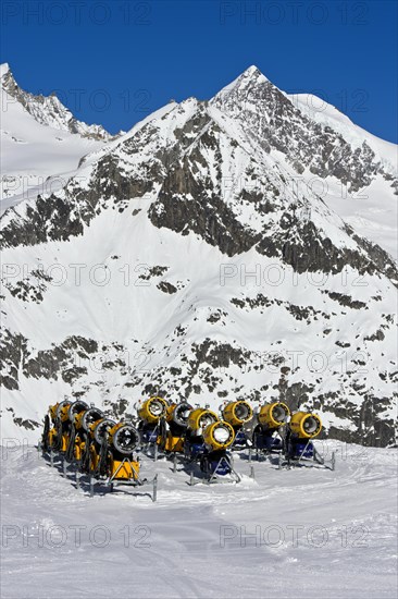 Snow cannons on ski slope