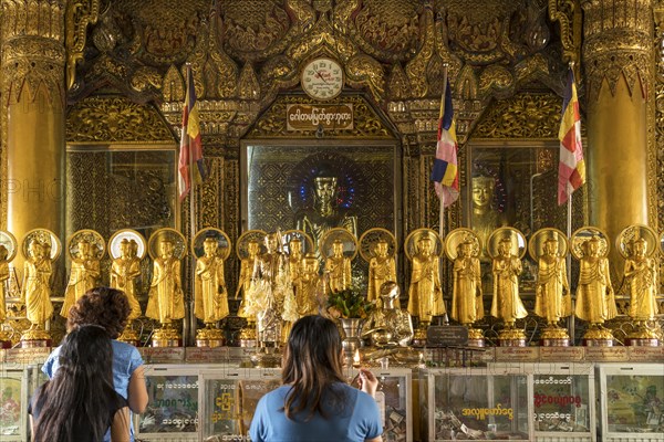 Praying Buddhists in the Sule Pagoda