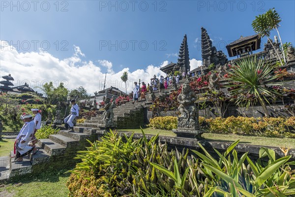 Devout Balinese descend stairs