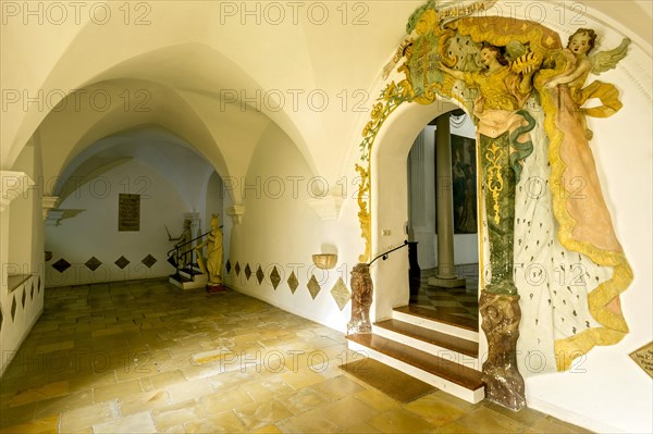 Cloister with stuccoed entrance to St. John Church