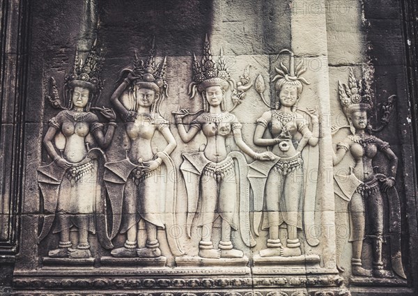 Stone relief of the divine dancers