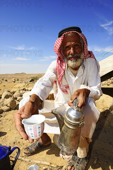 Bedouin preparing coffee with pan-roasted beans and kardamom