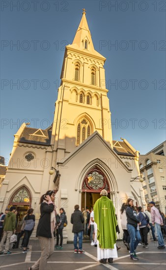 Priest standing in front of St Patrick's Cathedral