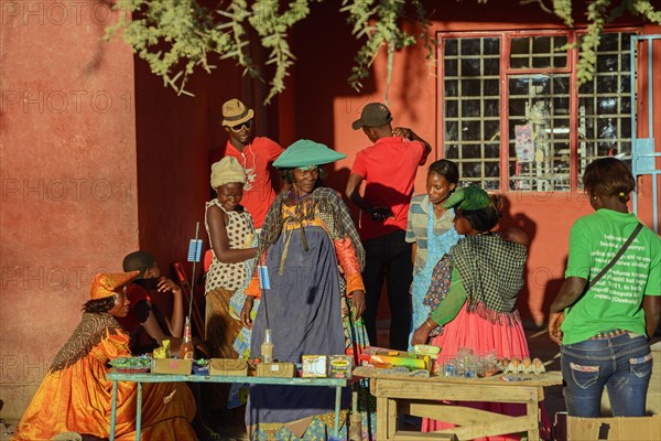 Locals in colorful clothes at a stall