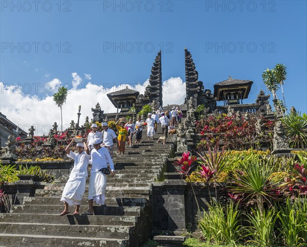 Devout Balinese descend stairs