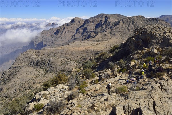 Tourists hiking in the Al Hajar al Gharbi mountains