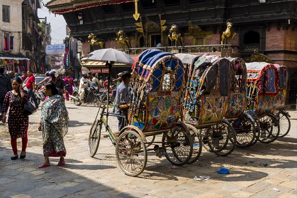 Bicycle rikshaws on Indra Chowk in front of Akash Bhairab Temple