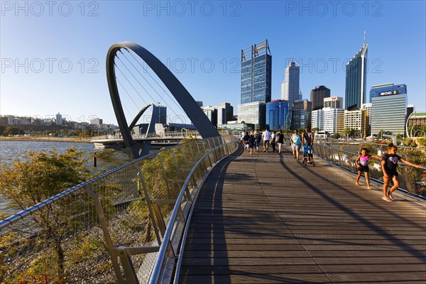 Foot bridge with city skyline