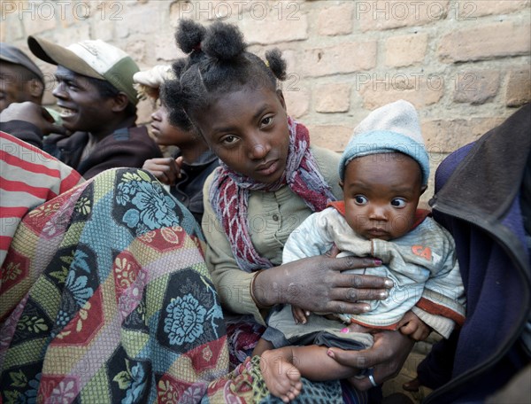 Homeless teenagers with baby on the street