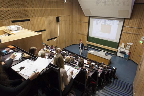 Professor and students during a lecture in the auditorium
