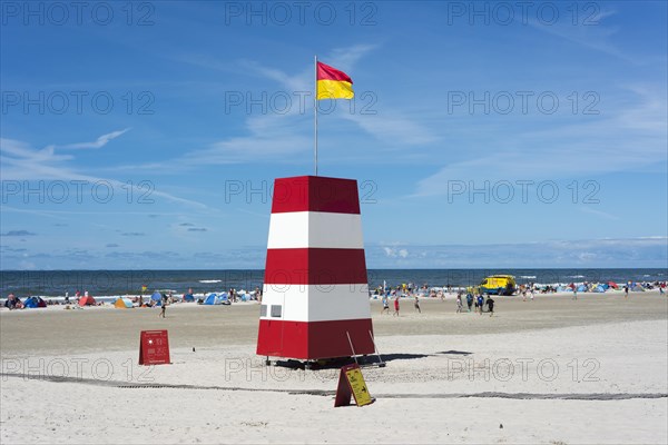 Guarded beach marked by flags