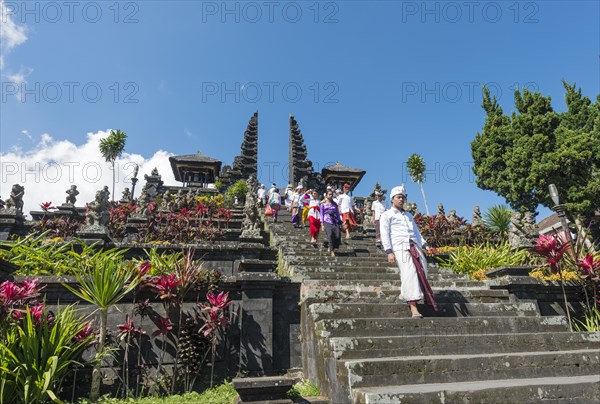 Devout Balinese descend stairs