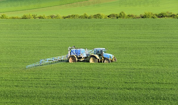 Tractor with field sprayer