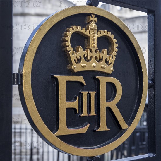 Sign of Queen Elizabeth II at a gate at the Tower of London