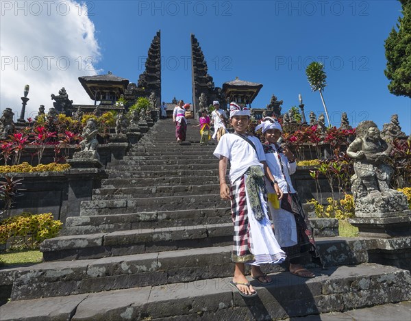 Devout Balinese descend stairs