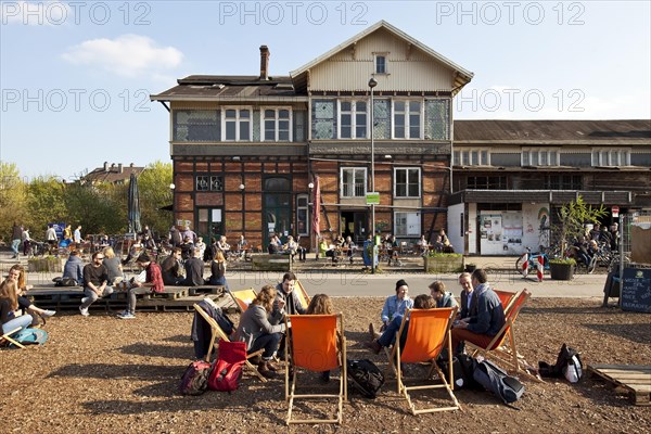 Young people at the Nordbahntrasse with the station Wuppertal-Mirke