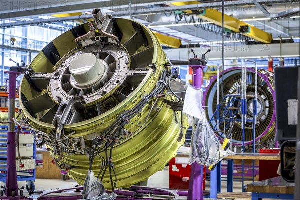 Airplane engine during maintenance in a warehouse