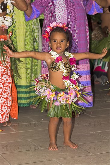 Little girl decorated with flowers