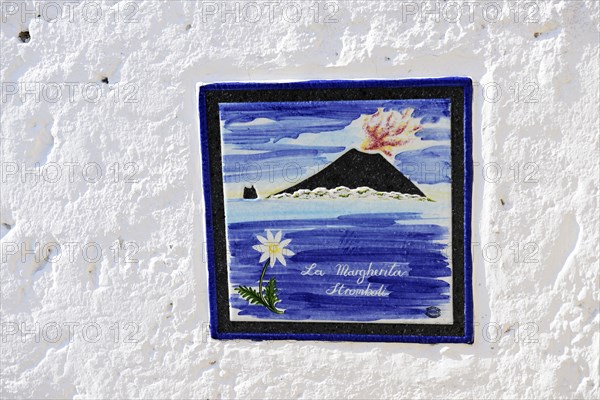Stromboli volcano as motif on house sign