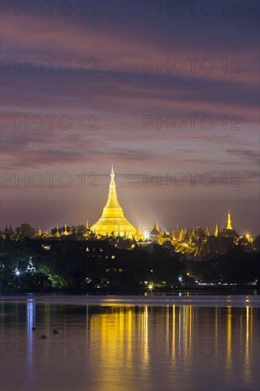 Illuminated Shwedagon Pagoda at sunset