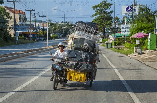 Motorcycle with heavily loaded side car