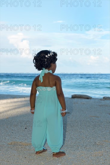 Little Maldivian girl on the sandy beach