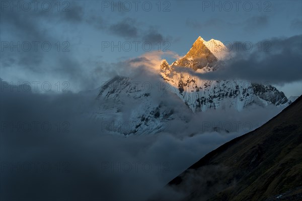 View on the summit of the mountain Machapuchare at sunset