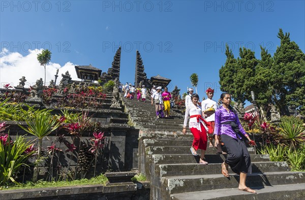 Devout Balinese descend stairs