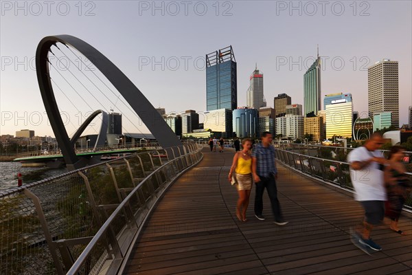 Foot bridge with city skyline